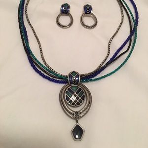 CHICO’S four-strand beaded necklace and earrings.